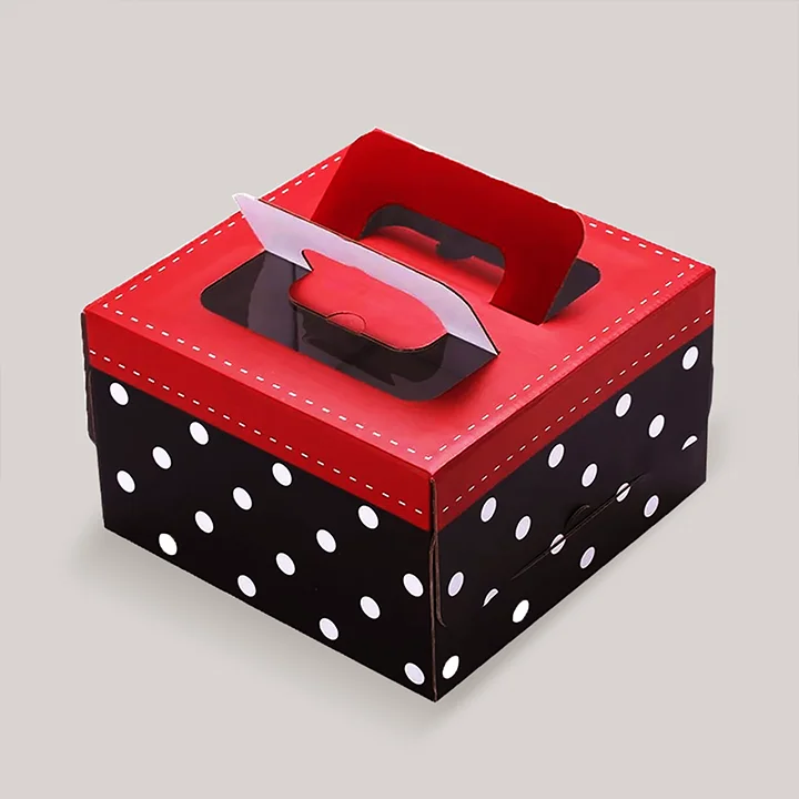 Cardboard cake carrier box with handled box design